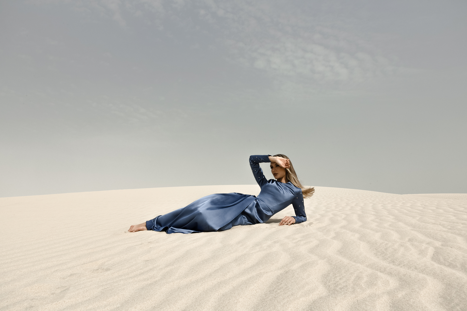 Draped satin gown with embroidered sleeves