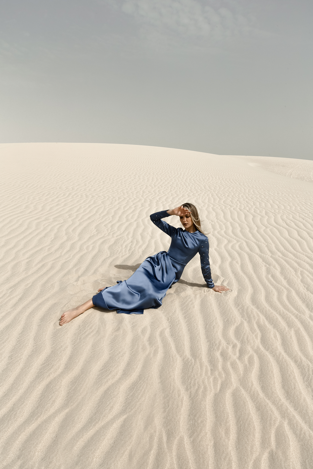 Draped satin gown with embroidered sleeves