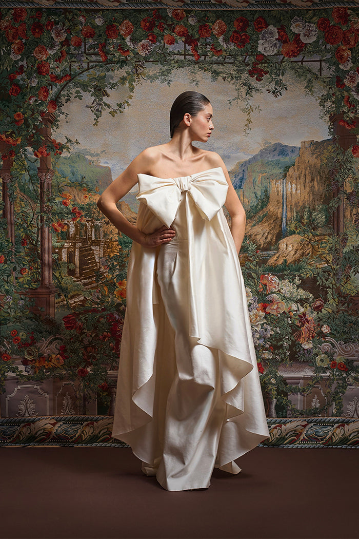 Wild silk maxi dress with an overskirt train and a voluminous bow