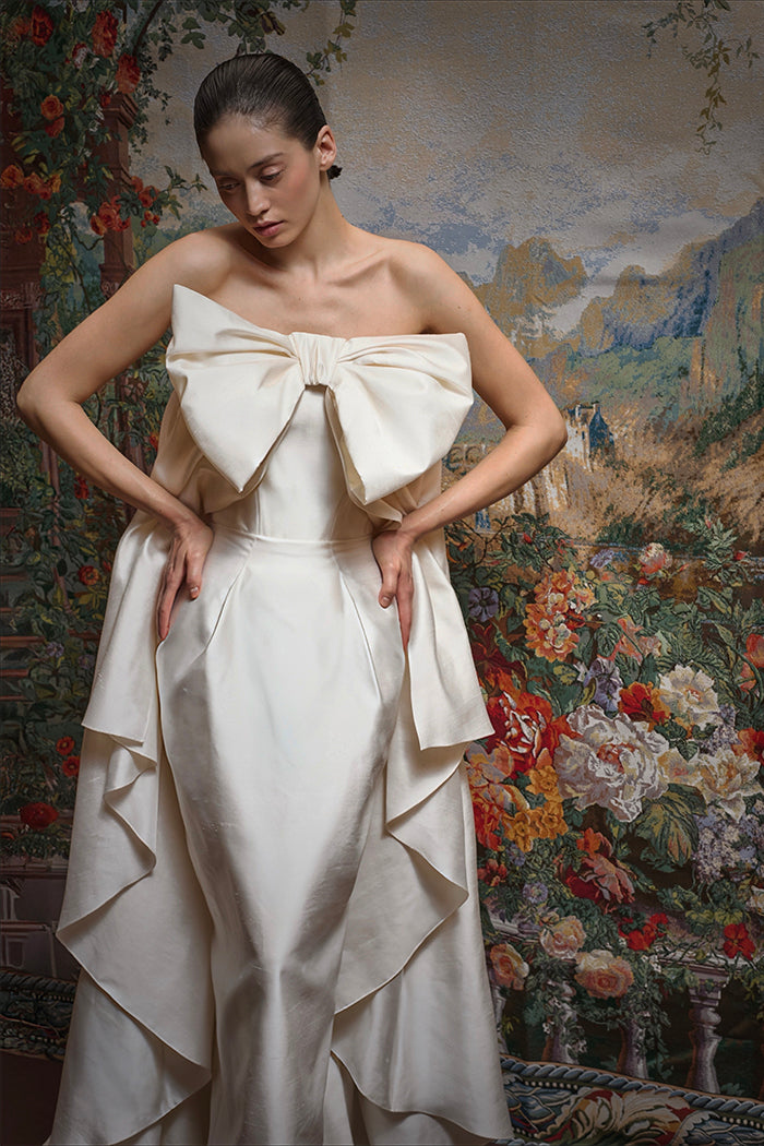 Wild silk maxi dress with an overskirt train and a voluminous bow
