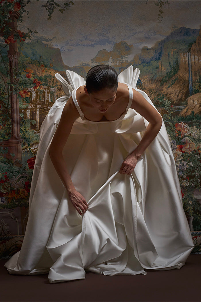 Satin maxi dress with a voluminous skirt and organza bows