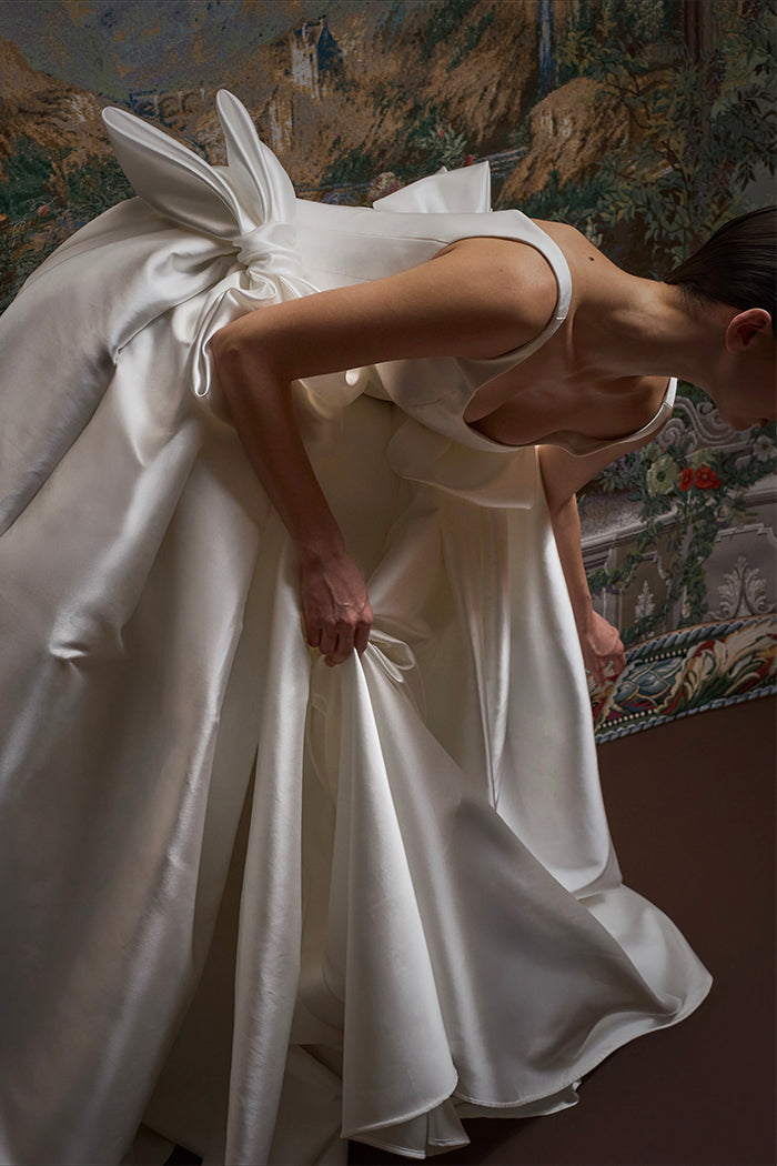 Satin maxi dress with a voluminous skirt and organza bows