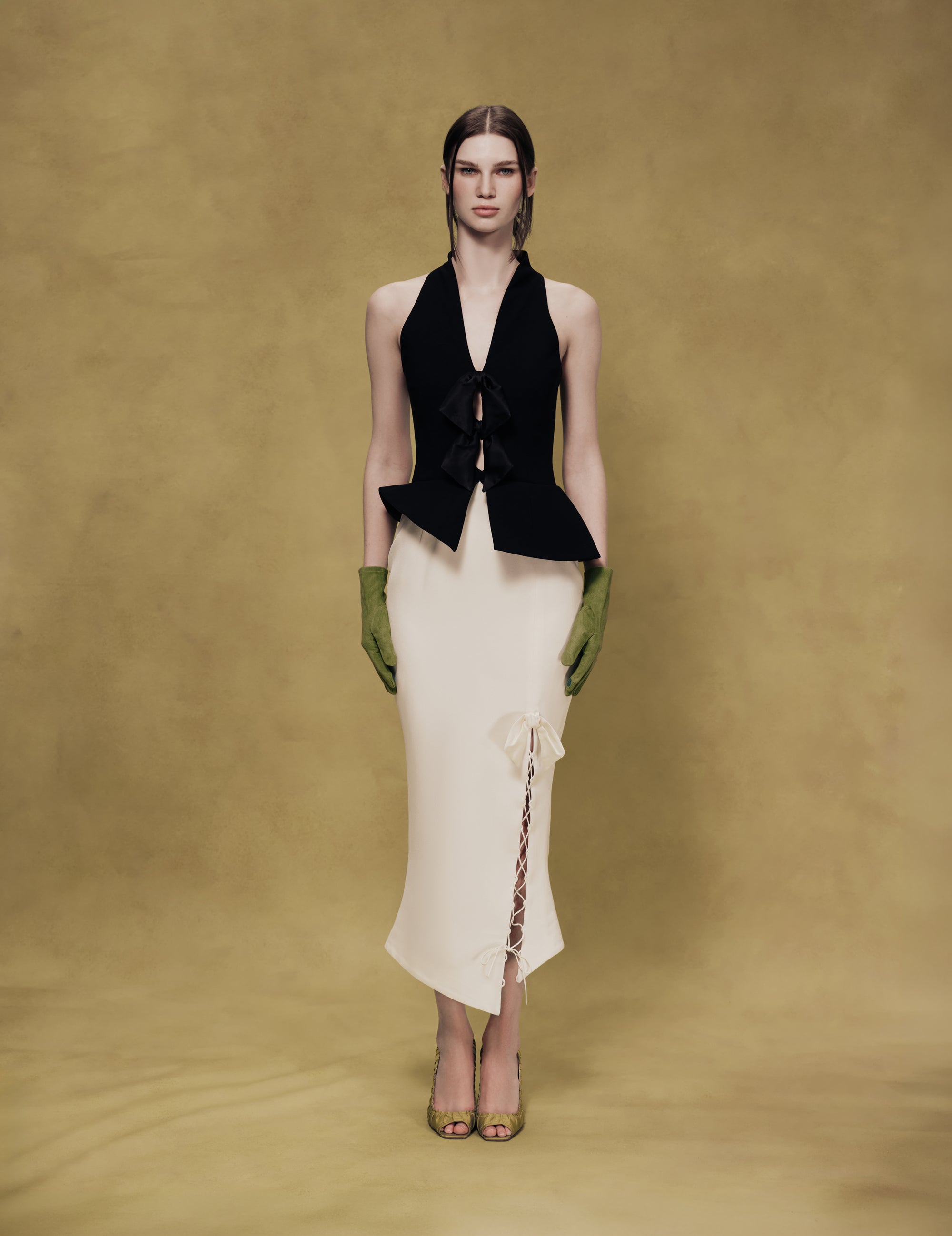 Midi dress with an asymmetrical cutout and a peplum