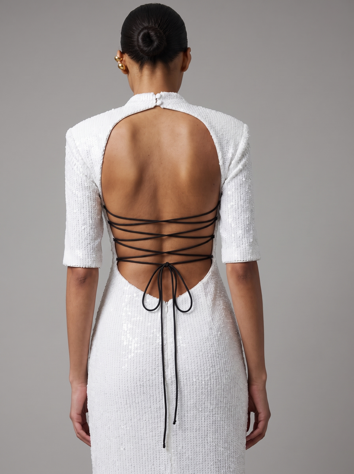 Sequinned long midi dress with an opened back and cutout