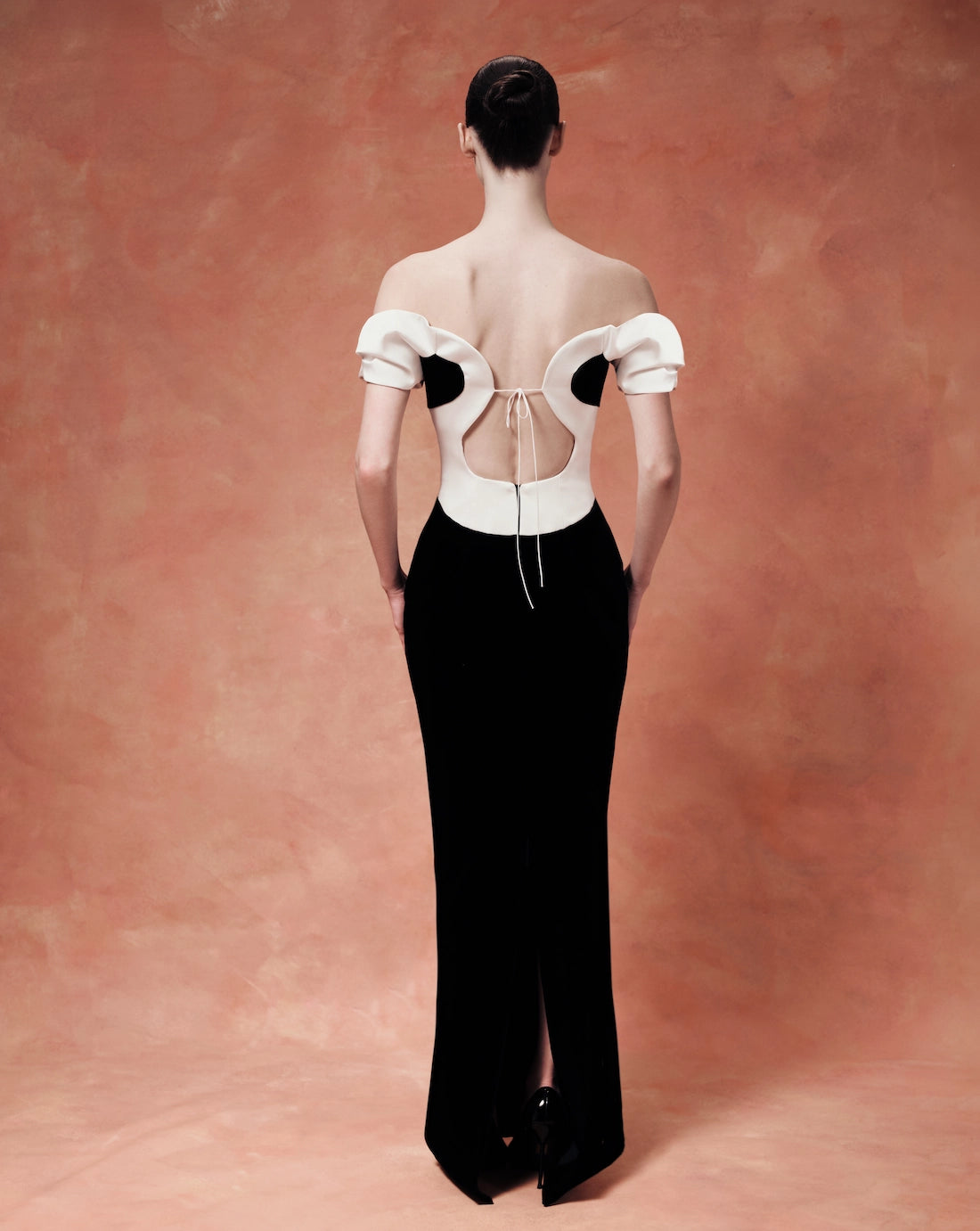 Velvet maxi dress with a sculpted neckline and open back