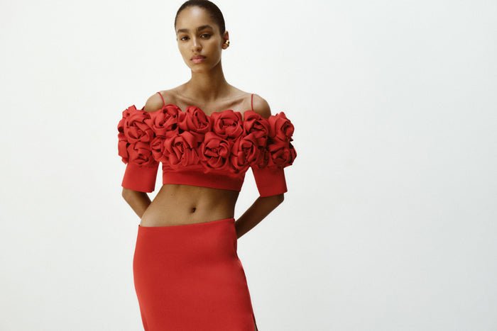 Cropped flower embellished satin top with an opened back – Rasario
