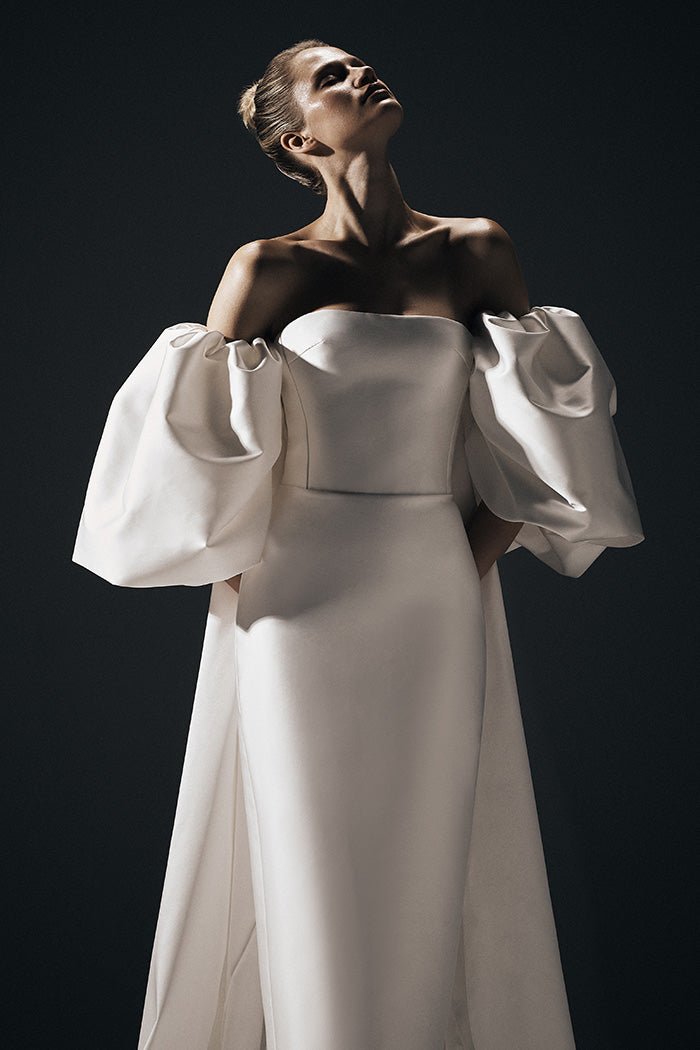 Satin gown with detachable voluminous sleeves and cape – Rasario