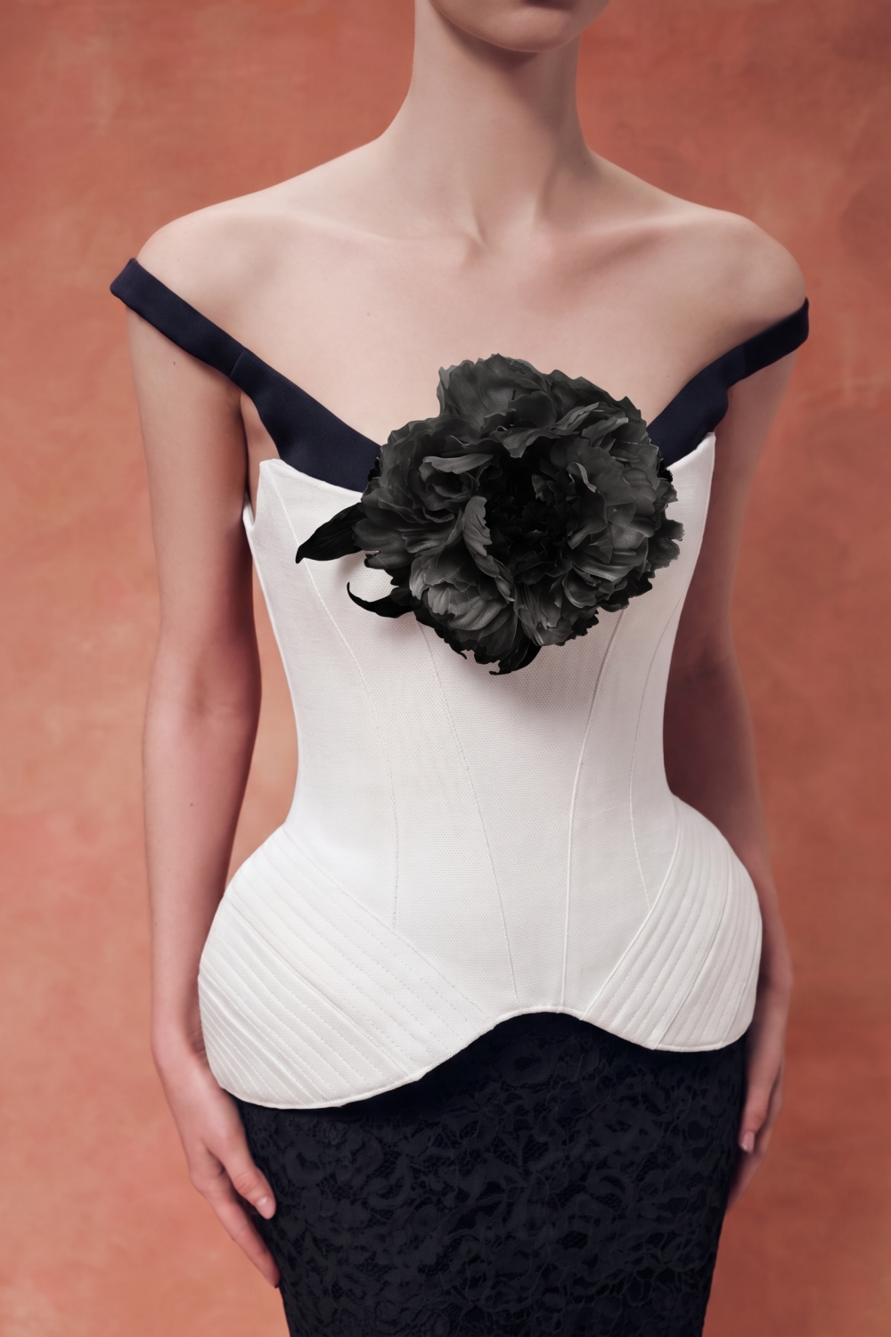 Corset with wide straps and a brooch