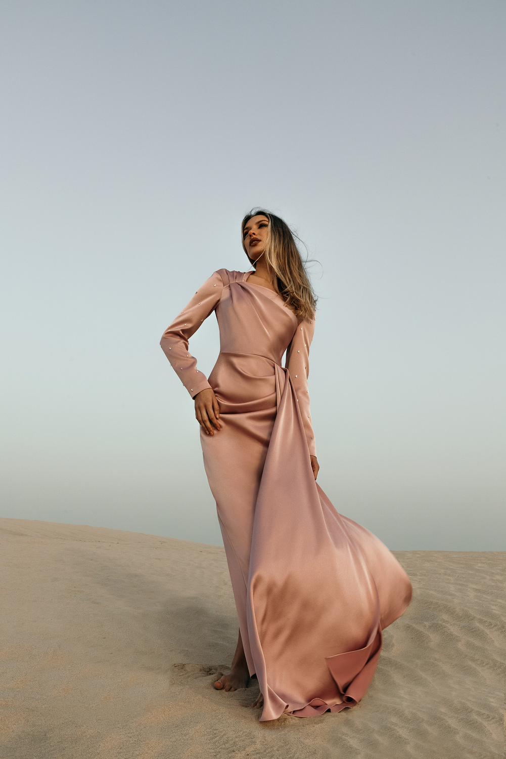 Asymmetric draped satin gown with embroidered sleeves