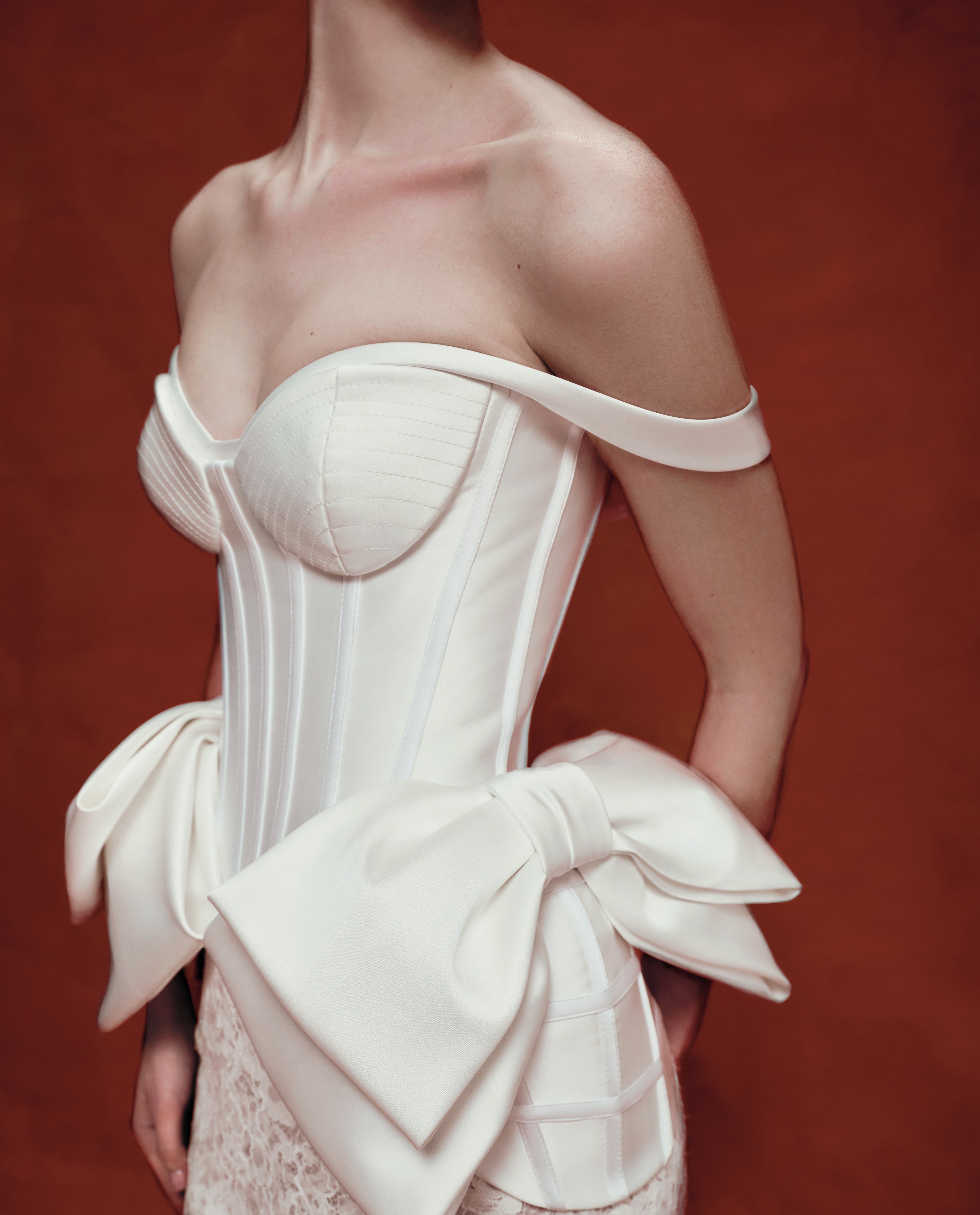 Sculpted satin corset with bows