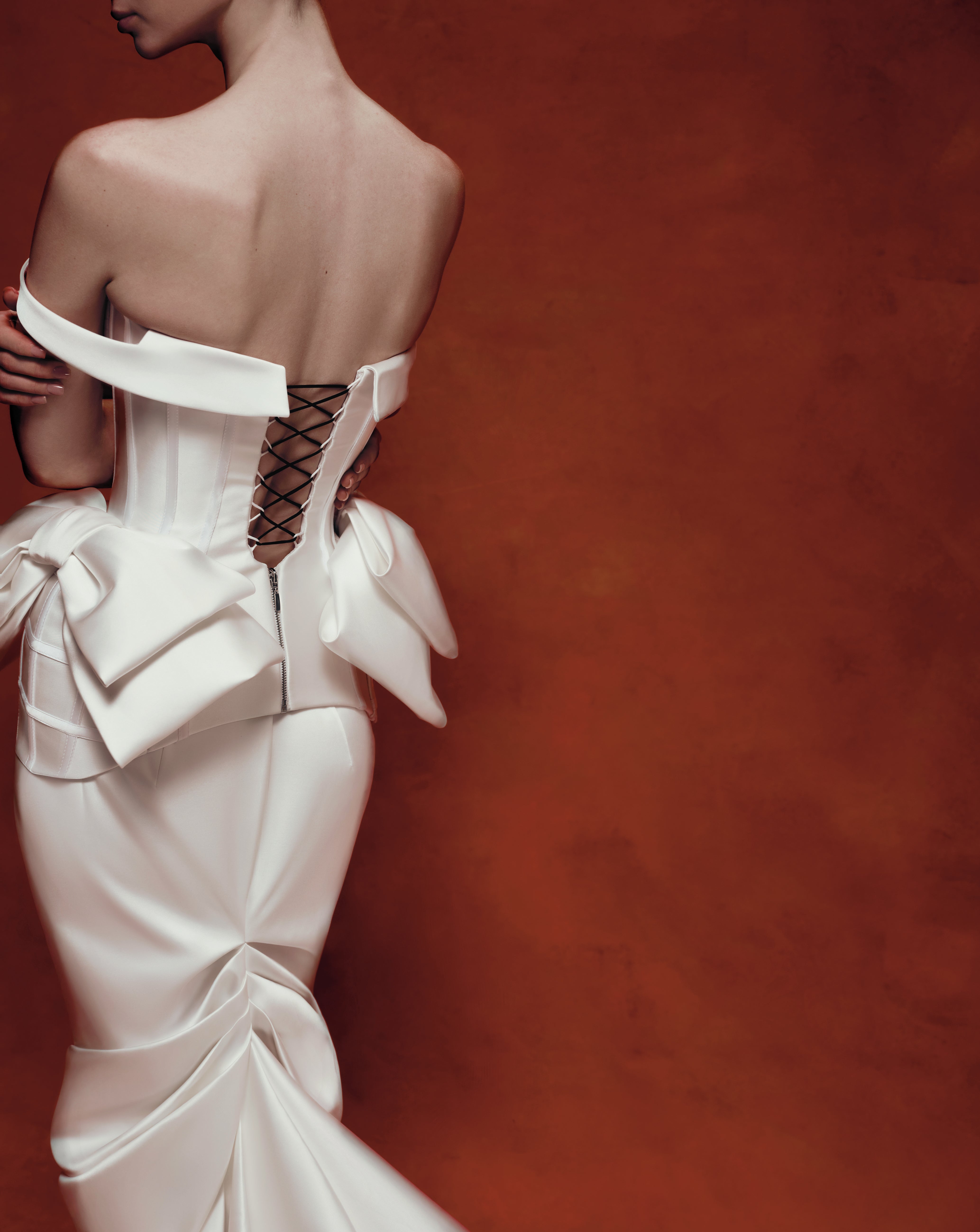 Sculpted satin corset with bows