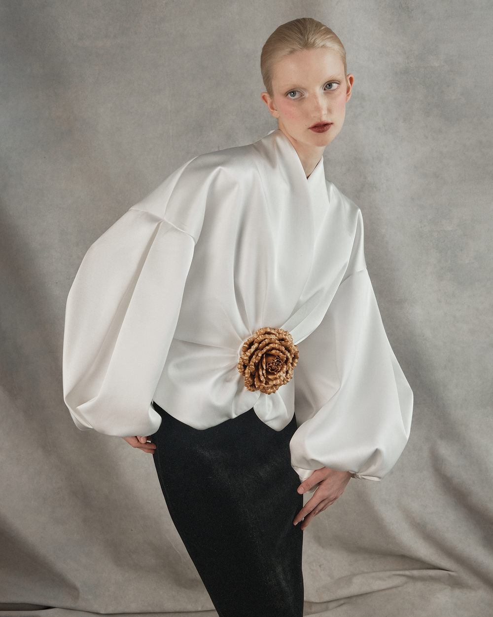 Satin jacket with voluminous sleeves and a flower