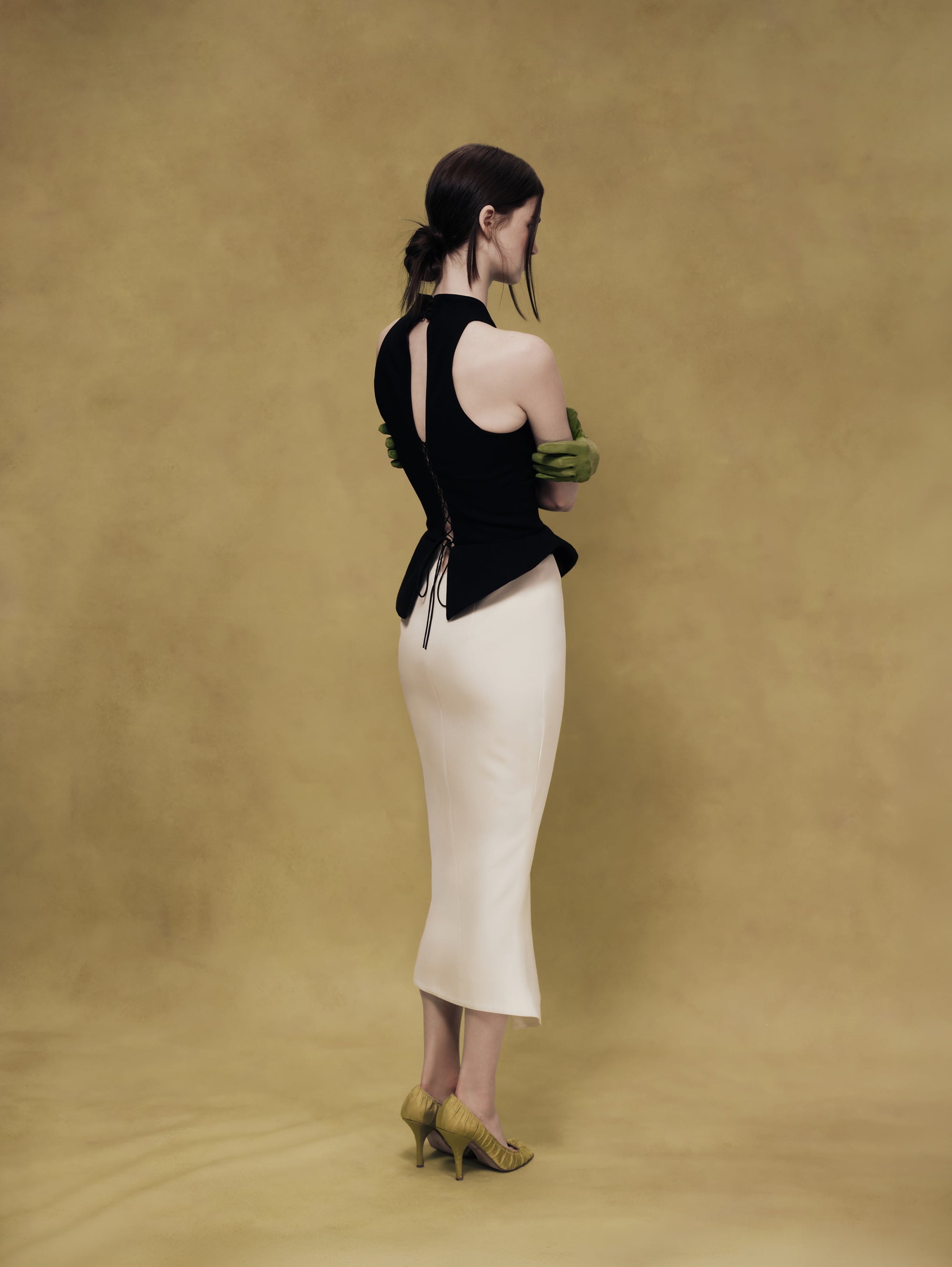 Midi dress with an asymmetrical cutout and a peplum