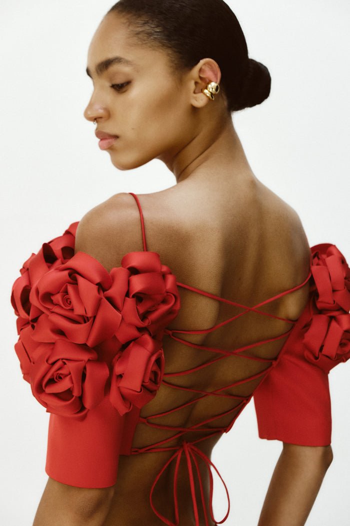 Cropped flower embellished satin top with an opened back – Rasario